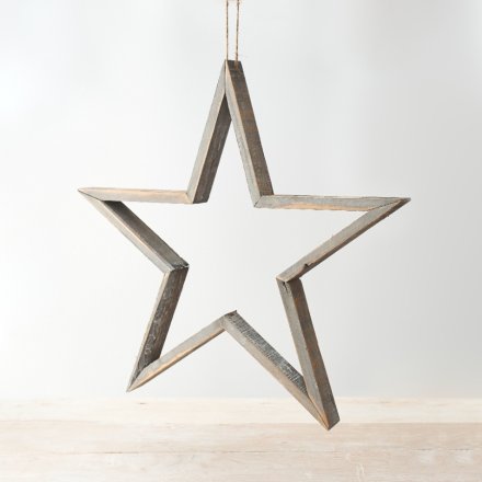 A rustic living grey wooden star with a washed finish and jute hanger.