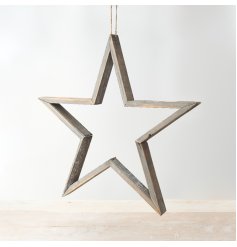 A rustic wooden star decoration with a grey washed finish and jute rope hanger.