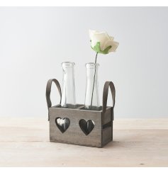  A grey wooden tray decorated with heart cut decals and chunky handles