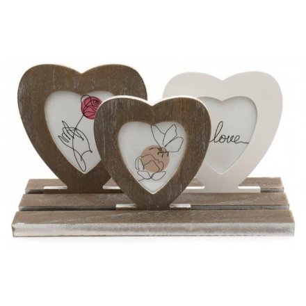A charming set of small shaped wooden picture frames set on a wooden base 