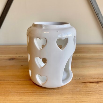 A tall standing ceramic based tlight holder featuring a dipped top and heart cut 