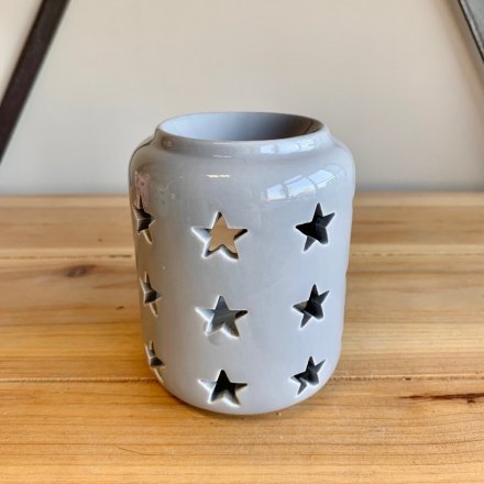  A charming little ceramic tlight holder with an added dipped top and pretty star cut decal surrounding it 