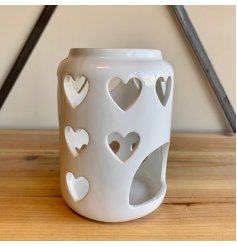 A tall standing ceramic based tlight holder featuring a dipped top and heart cut 