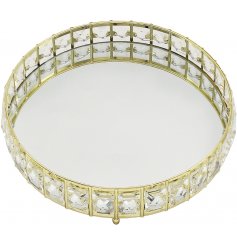   A sleek and stylish round mirrored tray, beautifully complete with a glitzy crystal edging 