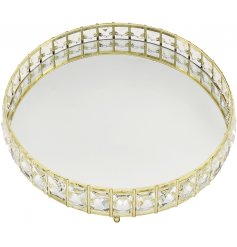  A sleek and stylish round mirrored tray, beautifully complete with a glitzy crystal edging 