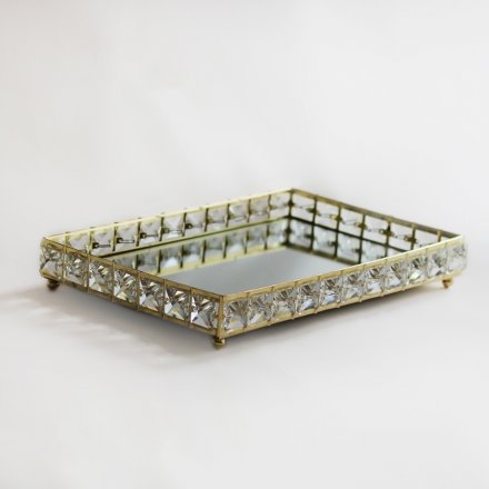 A large rectangular tray with crystal sides and a mirrored centre 