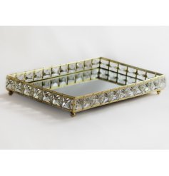 A large rectangular tray with crystal sides and a mirrored centre 