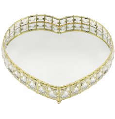 A gorgeously glitzy heart shaped tray with a mirrored centre and acrylic crystals surrounding it 