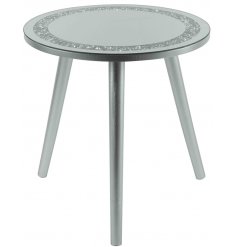  Sure to add a glitzy statement to any home space, a tall 3 legged table with a rounded shaped mirrored glitter top 