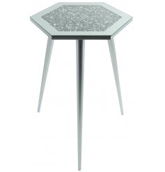  Sure to add a glitzy statement to any home space, a tall 3 legged table with a hexagon shaped mirrored glitter top 