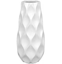  A sleek and simple themed decorative vase featuring a wavy embossed decal in a soft white hue 