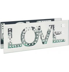 A gorgeously set mirrored 3 space T-light holder with an added LOVE text decal and sleek design 