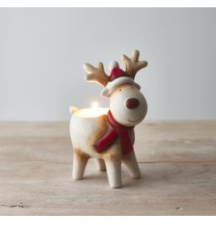  A festive little ceramic reindeer set with traditional colours and a tlight holder spacing 