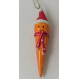 A cute and quirky ceramic carrot hanging decoration with a smiley face and festive decor 