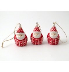  A small and traditional toned hanging ceramic Santa, set with added patterns and nordic tones 