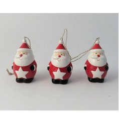  A small and traditional toned hanging ceramic Santa, set with added patterns and nordic tones 