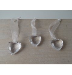 A small crystal inspired hanging heart with an organza bow 