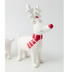  Place in any home during Christmas for an added Traditional touch with this charming little ceramic reindeer with a red