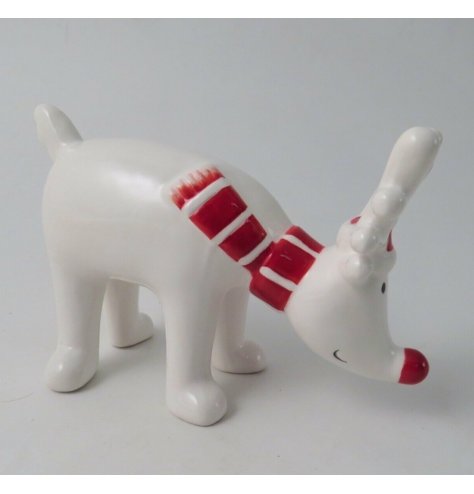 A white and red toned ceramic reindeer ornament with an added festive scarf decal 