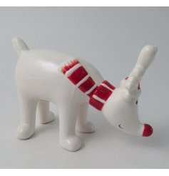   Place in any home during Christmas for an added Traditional touch with this charming little ceramic reindeer with a re