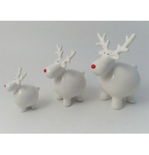A contemporary ceramic reindeer ornament with a red nose and tall antlers.