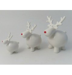 A cute little white ceramic reindeer with a festive red nose 
