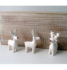 charming little ceramic reindeer with a red nose