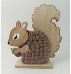 A cute wooden squirrel decoration with added woollen accents to the tail 