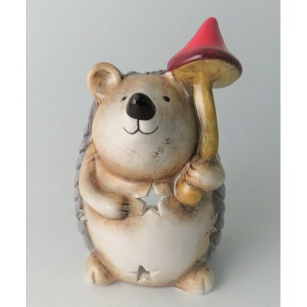 A small and sweet posed hedgehog figure with neutral colour tones and cut star decals