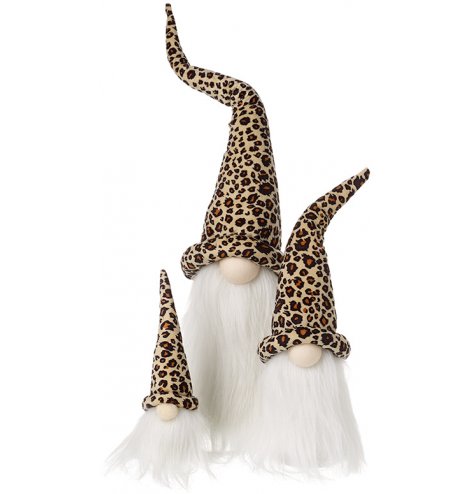 An assorted sized set of sitting gonks, each set with a bold leopard printed hat 