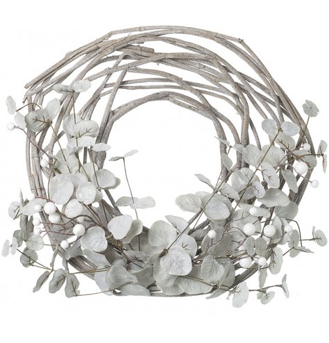 An artificial woven twig wreath decorated with a frosted mistletoe and berry spray 