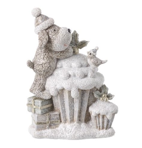A festive little neutral toned puppy trying to reach the top of a cupcake! A cute decoration for the home at Christmas 