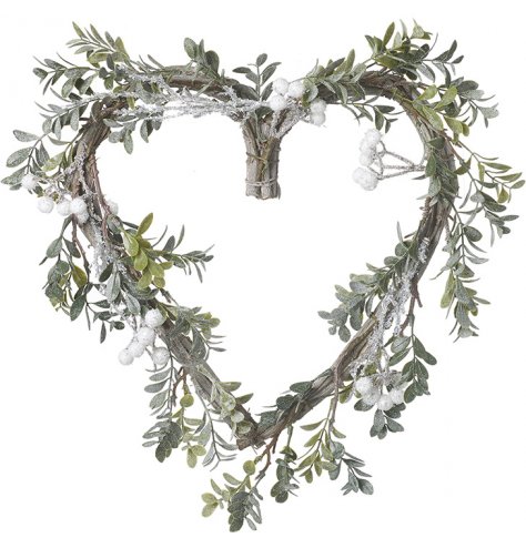 A heart shaped woven twig wreath entwined with foliage and berries and a sprinkle of glitter 