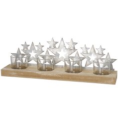 A gorgeous metal star and wood based candle display with distressed features and clear glass inserts