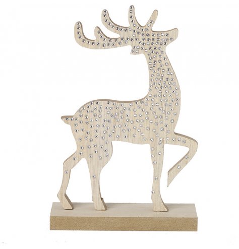 A nordic wooden deer with simple silver gems. 