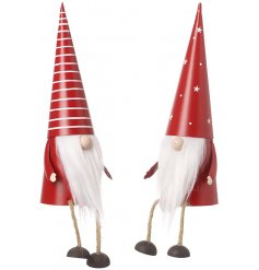 An assortment of stripy and starry patterned red and white gonks with faux fur beards and dangly legs 