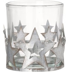A gorgeous star surrounded candle pot with distressed features and a clear glass insert