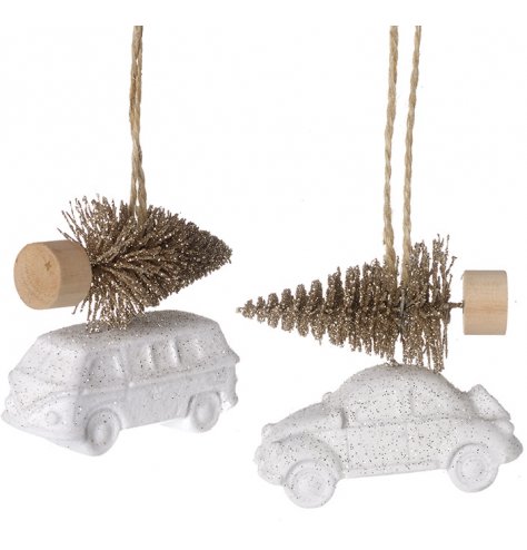 A mix of white toned car and camper hangers with added bristle trees on top and sprinkled with glitter 