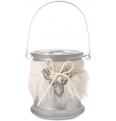 Wrapped with a faux fur sleeve and stag charm decal, this candle holder also features a silver crackle inner lining 