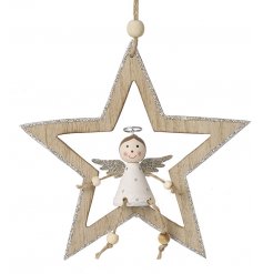 A hanging wooden star complete with a sitting angel in the centre 