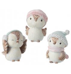 A sweet little mix of sitting owl figures, each decorated with snug looking grey and pink hats! 