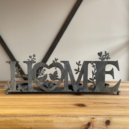A Charming Metal Four T-Light Holder with Home Wording Decal