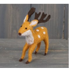 A charming little standing woollen reindeer with added spotted details 