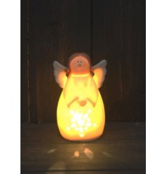 Complete with a warm glowing LED centre, this little angel has a smooth ceramic finish with neutral tones 