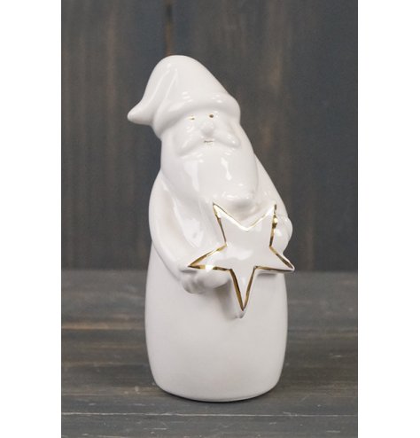 A small ceramic santa with a sleek white glaze and gold detailing 