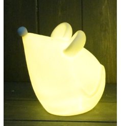 A small and simple ceramic mouse ornament set with a warm glowing LED centre and minimalistic finish 