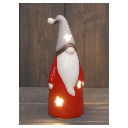 Perfect for adding a Nordic charm to your home decor at Christmas Time, an LED ceramic gonk with red and grey tones 