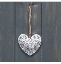 A charmingly rustic inspired hanging metal heart 