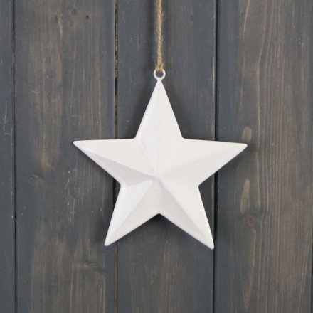 A sleek and simple hanging ceramic star with a white tone and jute string 