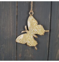A sweet little hanging butterfly decoration with a green floral decal to its centre